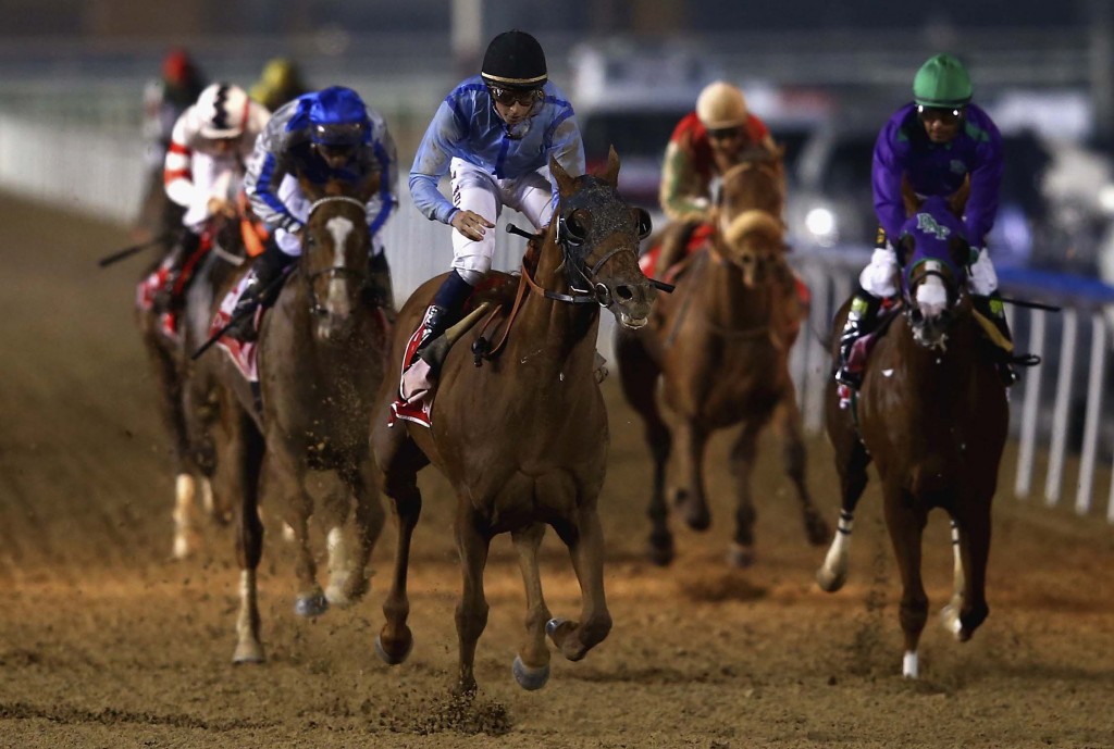 DUBAI, UNITED ARAB EMIRATES - MARCH 28:  William Buick celebrates riding Prince Bishop to victory during the Dubai World Cup at the Meydan Racecourse on March 28, 2015 in Dubai, United Arab Emirates.  (Photo by Francois Nel/Getty Images)