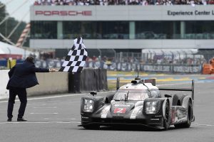 Switzerland's Neel Jani takes the Porsche 919 Hybrid N°2 over the finish line to win the 84th Le Mans 24-hours endurance race, on June 19, 2016 in Le Mans, western France. Porsche snatched their 18th Le Mans 24 Hour Race victory in the most dramatic of circumstances after Toyota suffered engine failure with just three minutes left on June 19, 2016. / AFP / JEAN-SEBASTIEN EVRARD        (Photo credit should read JEAN-SEBASTIEN EVRARD/AFP/Getty Images)